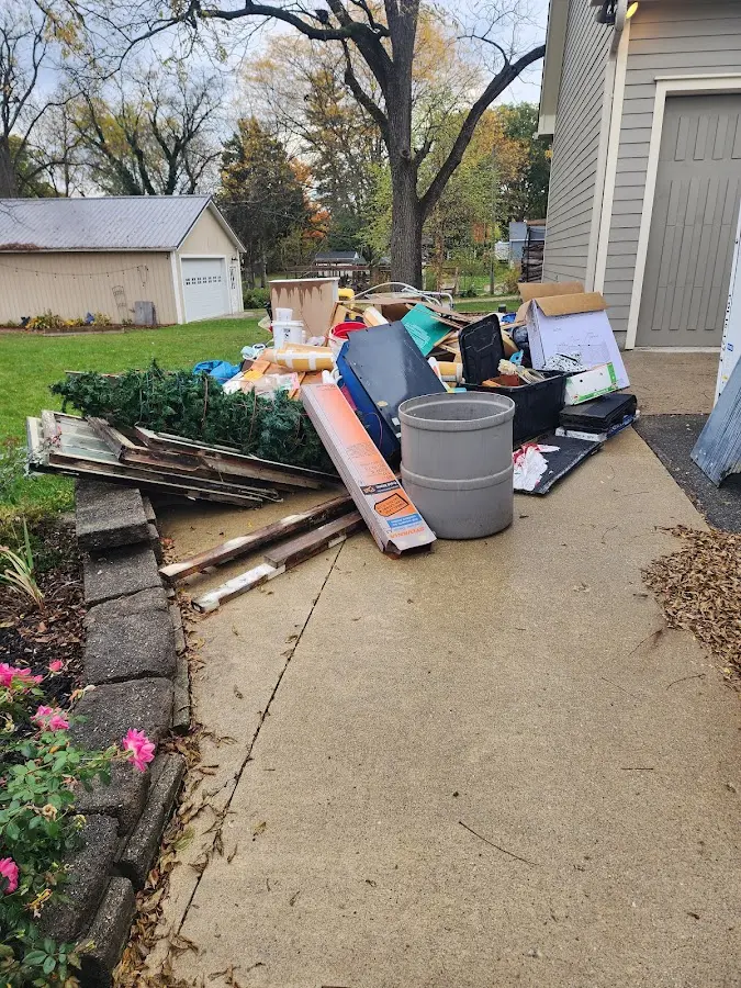 Dumpster being loaded with debris for Commercial Dumpster Rental in Athens